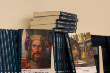 King Arthur and the Roundtable is displayed on a bookshelf.