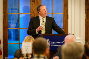 Dr. Matt Spaulding speaking at a podium.